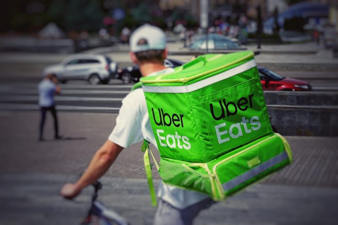 Uber Eats delivery driver on a bicycle, ready to start delivering food in the city